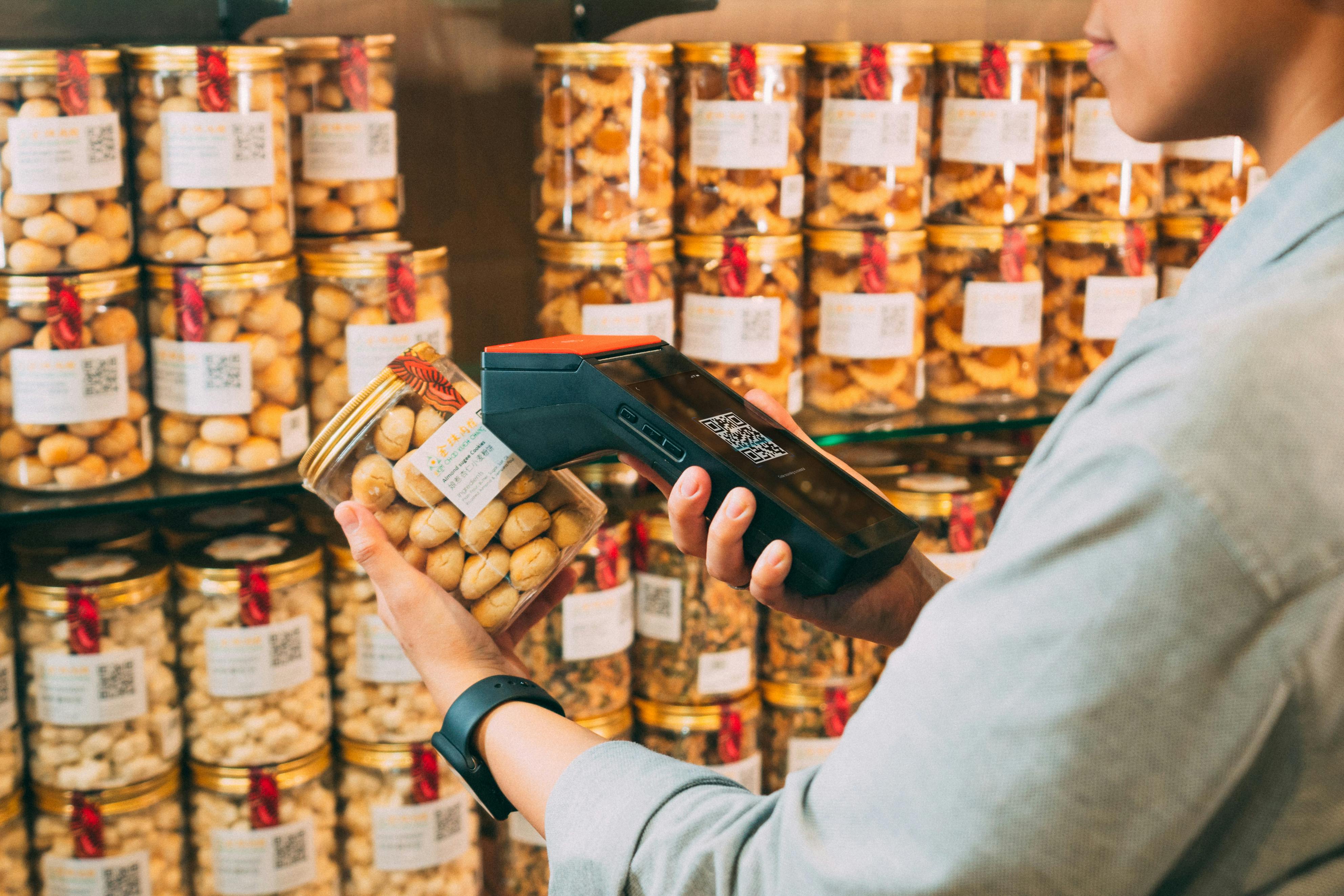 An image depicting a worker conducting an inventory count. The worker is focused on accurately checking stock levels on shelves, surrounded by neatly organized products. The scene emphasizes the importance of maintaining inventory accuracy in business operations.